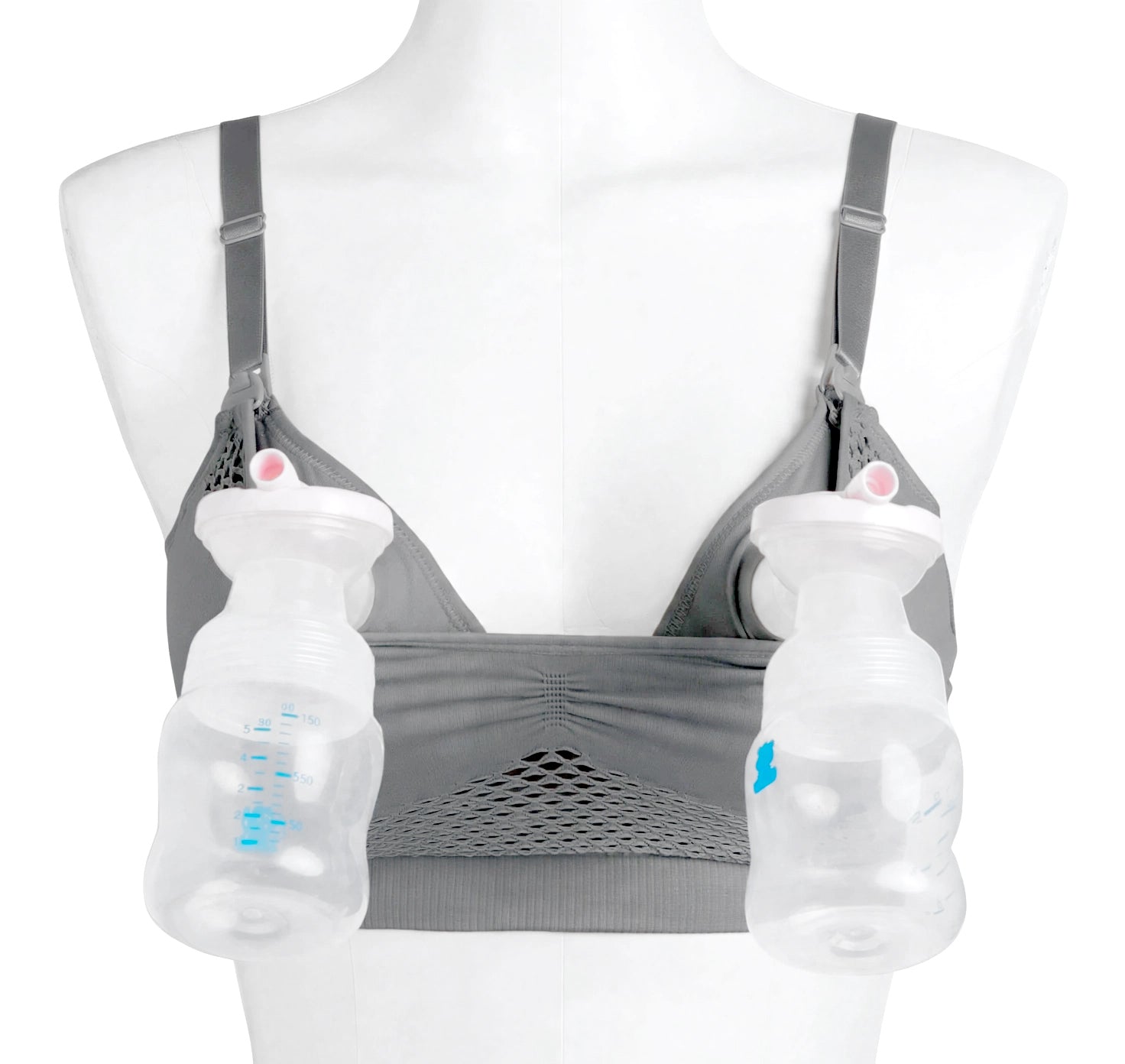 A gray nursing bra displayed on a white mannequin torso, with two clear plastic breast pump bottles attached to the cups.