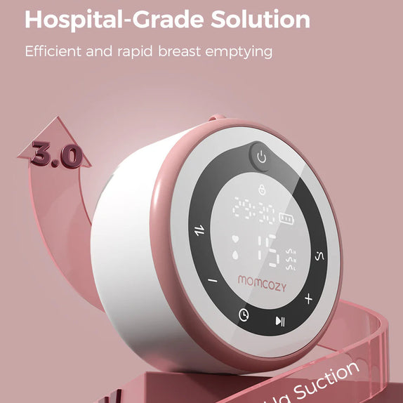 Pink breast pump with digital display on a pink background, featuring the brand 'momcozy'.
