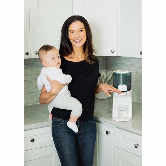 Mother using Formula water dispenser for baby - Baby Brezza